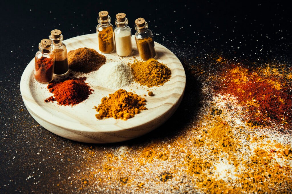Spices Decoration With Bottles Wooden Plate 1024x683